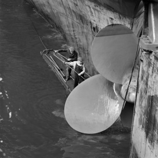 Cleaning the propellor of a ship, London Docks, September 1965