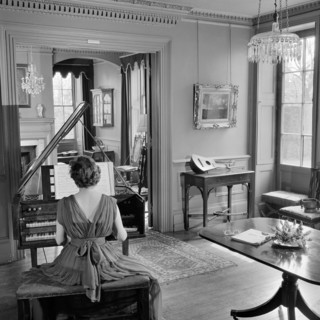 Woman in evening dress playing the harpsichord, Fenton House, London, 1960-1965