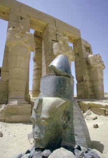 Granite head of Rameses II in front of the Ramesseum, Luxor (Thebes), Egypt. Artist: Tony Evans