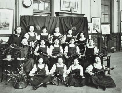 Girls swimming championship team with their shield, Tollington Park Central School, London, 1915. Artist: Unknown.