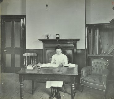 Female student sitting at desk, Shoreditch Technical Institute, London, 1907. Artist: Unknown.