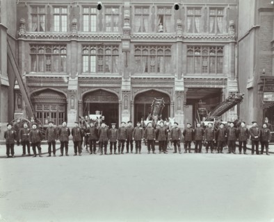 Firemen lined up outside Bishopsgate Fire Station, Bishopsgate, City of London, 1908. Artist: Unknown.