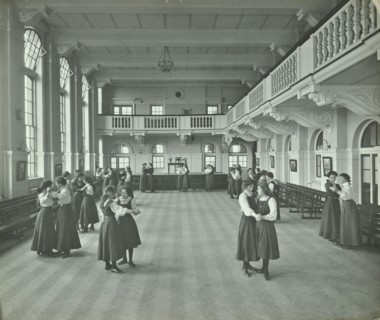 Girls dancing in the assembly hall, Clapham Secondary School, London, 1910. Artist: Unknown.