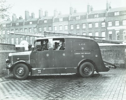 Firemen inside a fire engine, Kingsland Road Fire Station, London, 1935. Artist: Unknown.