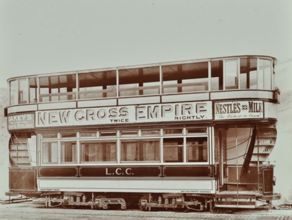 Double-decker electric tram with advertisement for the New Cross Empire, 1907. Artist: Unknown.