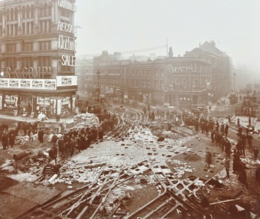 Laying tramlines at the junction of Whitechapel High Street and Commercial Road, London, 1907. Artist: Unknown.