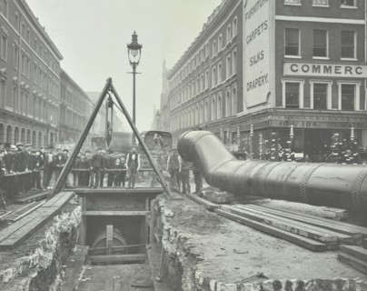 Replacing an old gas main, Commercial Street, London, 1906. Artist: Unknown.