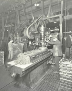Man using a miller and planer, Charlton Central Repair Depot, London, 1932. Artist: Unknown.