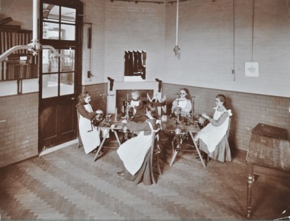 Girls knitting socks by machine at the Elm Lodge School for Blind Girls, London, 1908. Artist: Unknown.