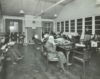 Men sitting in the library at Cedars Lodge old people's home, Wandsworth, London, 1939. Artist: Unknown.