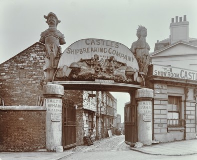 Ships' figureheads over the gate at Castle's Shipbreaking Yard, Westminster, London, 1909. Artist: Unknown.