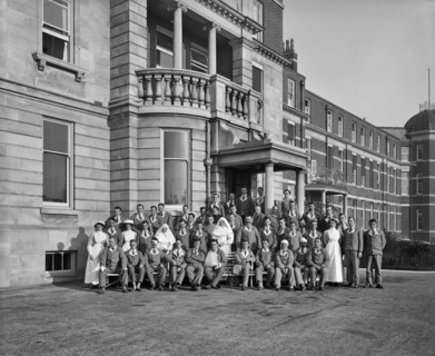 Nurses, nuns and military patients outside St Andrew's Hospital, Dollis Hill, London, October 1916