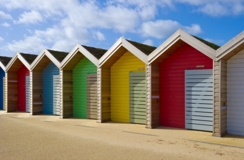 Row of different coloured beach huts, Blyth, Northumberland, 2010