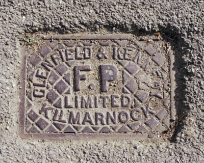 Iron water stop tap cover plate made by Clenfield & Kennedy of Kilmarnock, Swindon, Wiltshire, 2006
