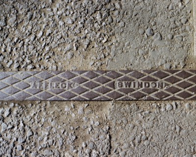 Pavement rainwater gully cover plate made by Affleck of Swindon, Swindon, Wiltshire, 2006