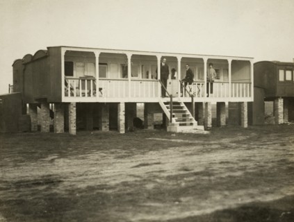 Railway carriage converted into a holiday home, possibly at Shoreham-by-Sea, West Sussex, 1920s