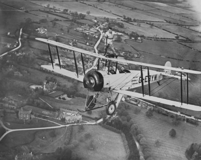 Man wing walking on an Avro 504 biplane without a harness, 20th century