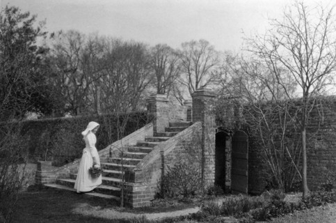 Woman standing at the base of the garden steps, Ufton Court, Ufton Nervet, Berkshire. c1901