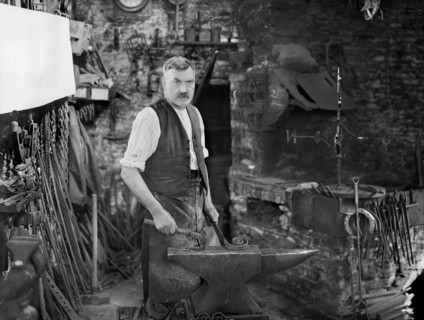 Mr Jefferies at work in the forge, Southrop, Cotswolds, Gloucestershire, 1938