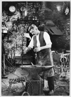 Mr Jefferies at work in the forge, Southrop, Cotswolds, Gloucestershire, 1938