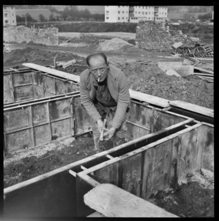 Builder working on the Penhill Estate, Swindon, Wiltshire, 1955