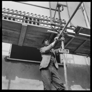 Builder working on the Penhill Estate, Swindon, Wiltshire, 1955