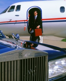1987 Rolls Royce Silver Spirit with executive disembarking jet. Artist: Unknown.