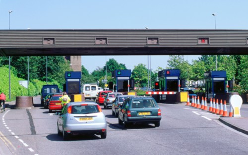 Traffic at toll booths on Itchen Bridge, Southampton. Artist: Unknown.