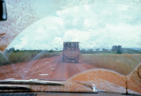 View through muddy windsreen on African dirt road. Artist: Unknown.
