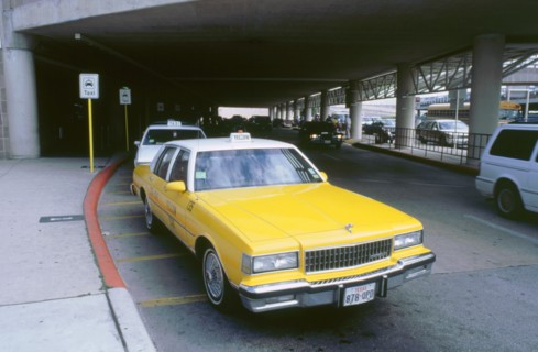 Yellow taxi cab at airport. Artist: Unknown.