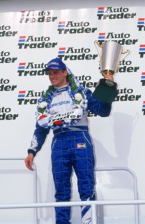 Rickard Rydell celebrates victory.British touring cars.Thruxton. Artist: Unknown.