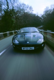 2002 Jaguar XKR coupe. Artist: Unknown.