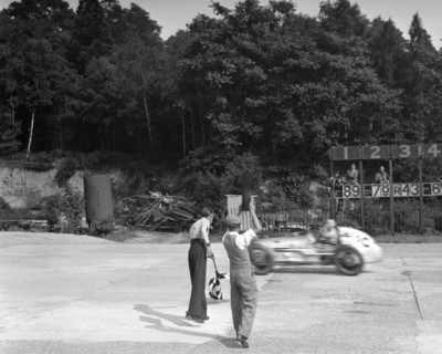 Kay Petre's Austin OHC 744 cc, LCC Relay GP, Brooklands, 26 July 1937. Artist: Bill Brunell.