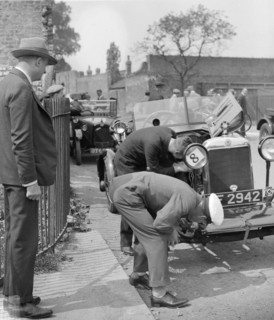 Inspecting the Star car of B Mott. Artist: Bill Brunell.