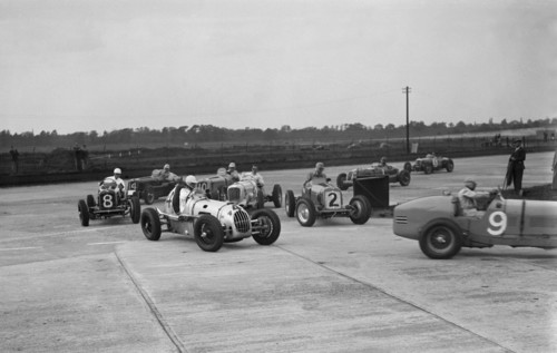 Cars racing at the BARC Meeting on the Campbell Circuit, Brooklands, 15 October 1938. Artist: Bill Brunell.