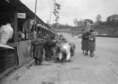 N Black and CW Fiennes' MG C type in the pits at the JCC Double Twelve race, Brooklands, May 1931. Artist: Bill Brunell.