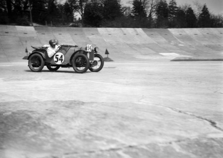 Austin Ulster of Victoria Worsley and R Latham-Boote, JCC Double Twelve race, Brooklands, 1931. Artist: Bill Brunell.