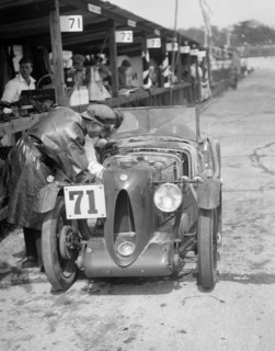 MG C type of Ron Horton and Bill Humphreys in the pits, JCC Double Twelve race, Brooklands, 1931. Artist: Bill Brunell.