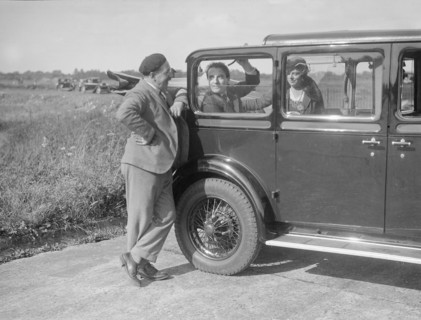 Hugh McConnell, Sammy Davis and Mrs Davis with an Austin 20/6 landaulette at Brooklands, 1931. Artist: Bill Brunell.