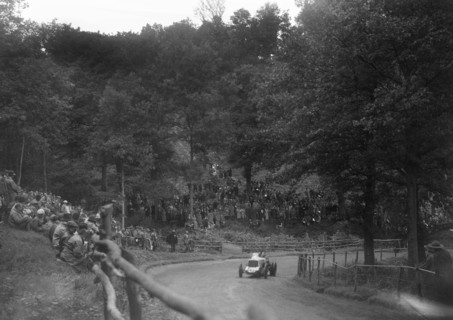 Raymond Mays' Vauxhall-Villiers competing in the Shelsley Walsh Speed Hill Climb, Worcestershire. Artist: Bill Brunell.
