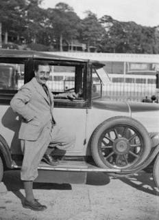 Hugh McConell beside a car, Brooklands, 3 August 1931. Artist: Bill Brunell.