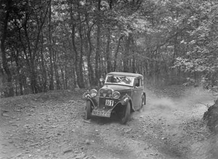 Singer coupe competing in the B&HMC Brighton-Beer Trial, Fingle Bridge Hill, Devon, 1934. Artist: Bill Brunell.