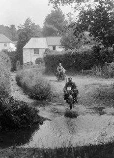 Motorcycles competing in the B&HMC Brighton-Beer Trial, Windout Lane, near Dunsford, Devon, 1934. Artist: Bill Brunell.