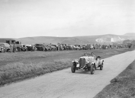 Ford V8 open tourer of GJC Matthews competing at the Lewes Speed Trials, Sussex, 1938. Artist: Bill Brunell.