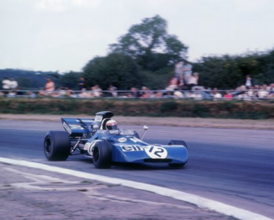 Tyrrell 003 driven by Jackie Stewart in 1971 British GP. Artist: Unknown.