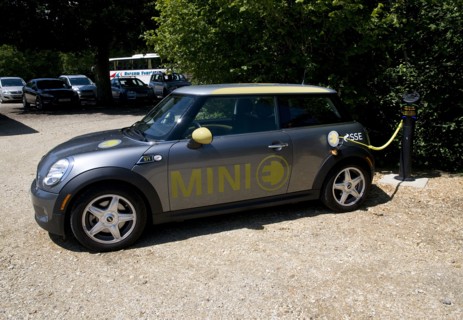 Electric Mini at battery charging point 2011 Artist: Unknown.
