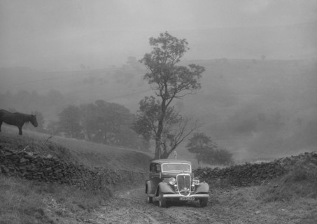 Ford V8 saloon of AKB Clarkson competing in the MCC Sporting Trial, 1935. Artist: Bill Brunell.