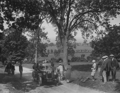 Austin 12/4 open 4-seater tourer competing in the JCC Inter-Centre Rally, 1932. Artist: Bill Brunell.