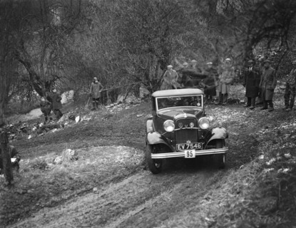 Ford V8 open tourer of H Hillcoat competing in the Sunbac Colmore Trial, Gloucestershire, 1933. Artist: Bill Brunell.