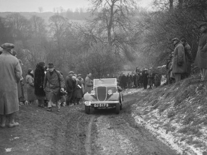 Ford V8 open tourer of H Hillcoat competing at the Sunbac Colmore Trial, Gloucestershire, 1933. Artist: Bill Brunell.